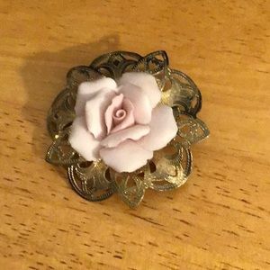 Vintage gold tone pin with pink rose.